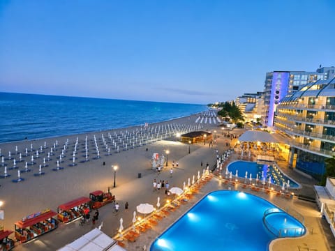 Property building, Nearby landmark, Night, Natural landscape, Beach, Swimming pool, Swimming pool, sunbed