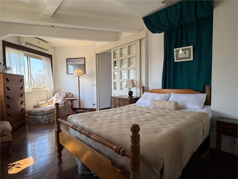 Bed, Seating area, Bedroom