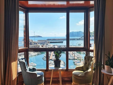 Natural landscape, View (from property/room), Living room, Seating area, Sea view