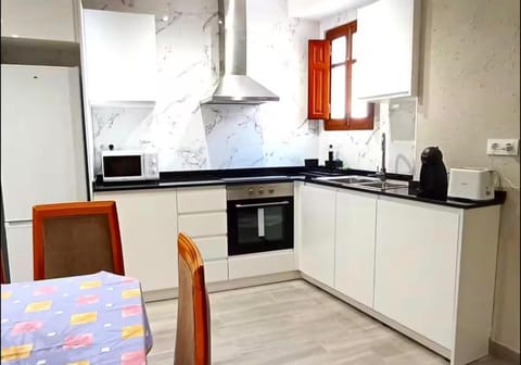 Kitchen or kitchenette, oven, stove, toaster