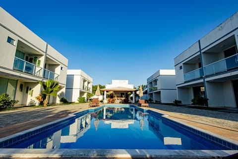 Property building, Day, Pool view, Swimming pool, sunbed