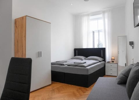 Bed, Seating area, Bedroom, towels, wardrobe