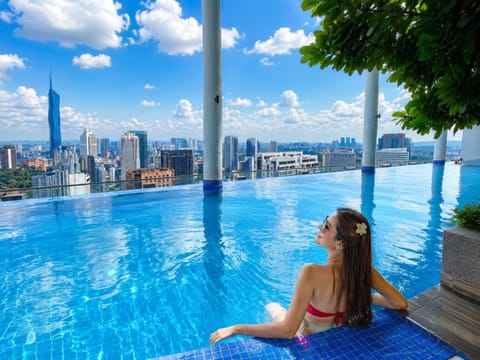 Property building, Nearby landmark, Day, People, Natural landscape, City view, Pool view, Swimming pool, group of guests, sunbed