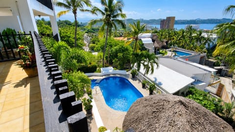 Property building, Patio, Day, Natural landscape, Garden, Pool view, Sea view, Swimming pool