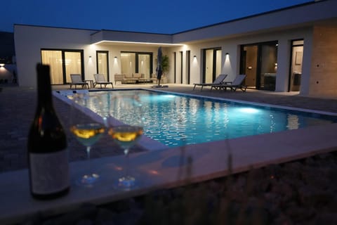 Patio, Night, Pool view, Swimming pool, sunbed