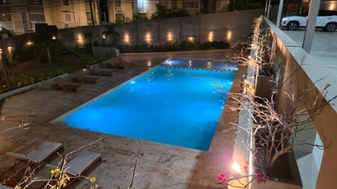 Patio, Night, Pool view, Swimming pool, sunbed