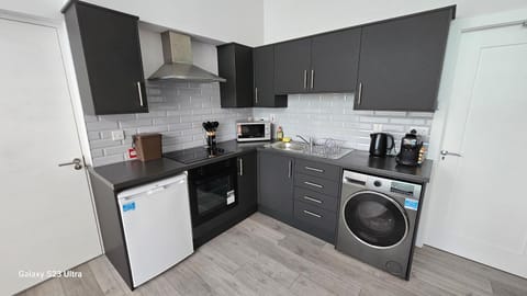Coffee/tea facilities, oven, stove, toaster, washing machine, dryer