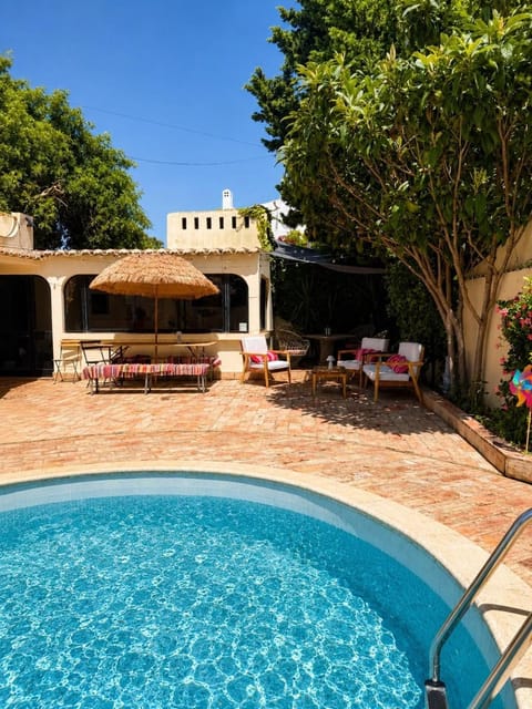 Property building, Patio, Day, Garden, Balcony/Terrace, Pool view, Swimming pool, Swimming pool, sunbed