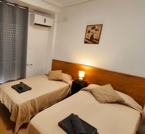 Bed, Photo of the whole room, Bedroom, towels, air conditioner