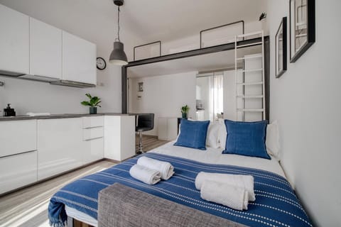 Bed, towels, wardrobe
