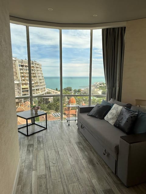 Natural landscape, View (from property/room), Living room, Seating area, Sea view