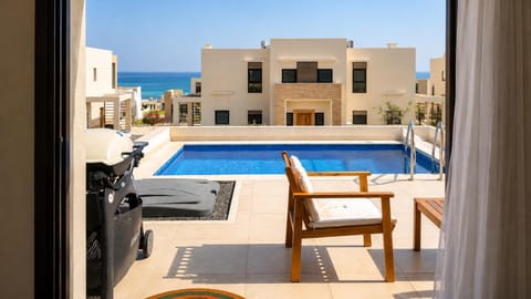 View (from property/room), Balcony/Terrace, Balcony/Terrace, Seating area, Beach, Beach, Pool view, Sea view, Swimming pool, Swimming pool