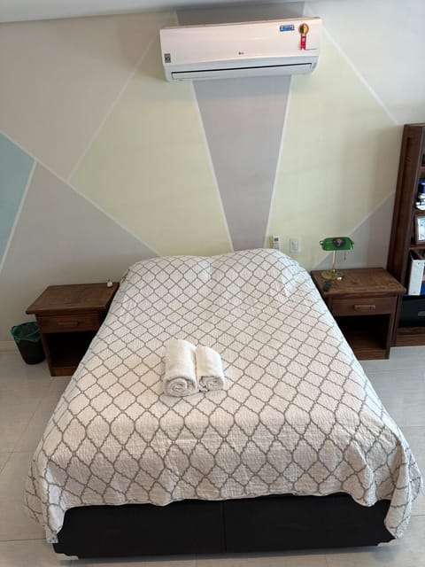 Bed, towels, air conditioner