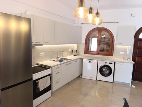 Kitchen or kitchenette, stove, washing machine
