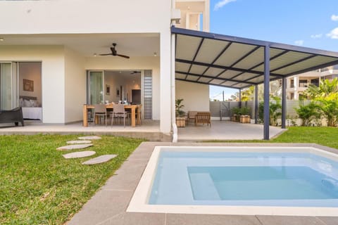 Property building, Patio, Dining area, Swimming pool