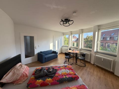 Bed, Living room, Seating area, Bedroom