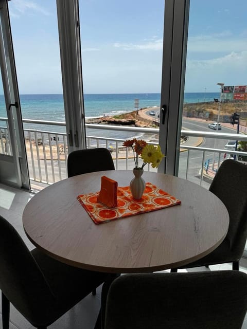 View (from property/room), Living room, Seating area, Beach, Sea view