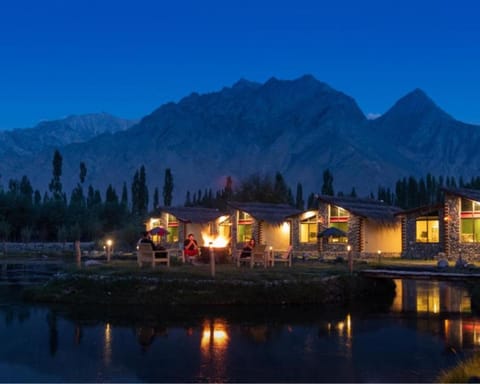 Property building, Nearby landmark, Night, Natural landscape, Lake view, Mountain view