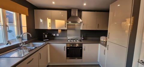 Kitchen or kitchenette, dishwasher, oven, stove