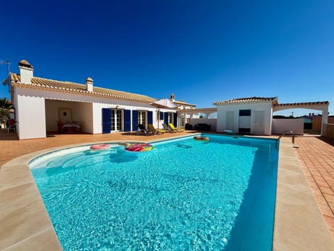 Property building, Patio, Pool view, Swimming pool, sunbed