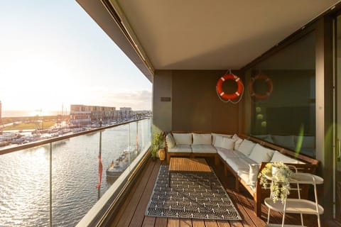 View (from property/room), Balcony/Terrace, Seating area, River view, Sea view, Sunset