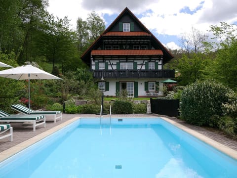 Property building, Living room, Swimming pool