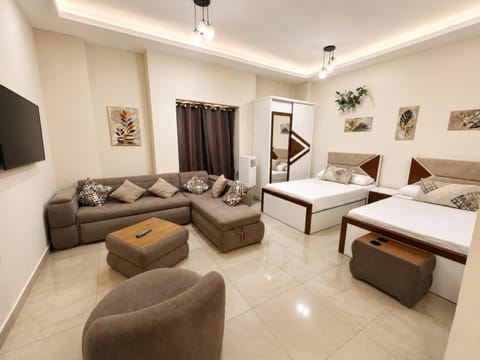 Communal lounge/ TV room, Bed, TV and multimedia, Living room, Photo of the whole room, Seating area, Bedroom
