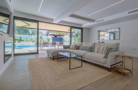 Patio, Living room, Seating area, Pool view, Swimming pool