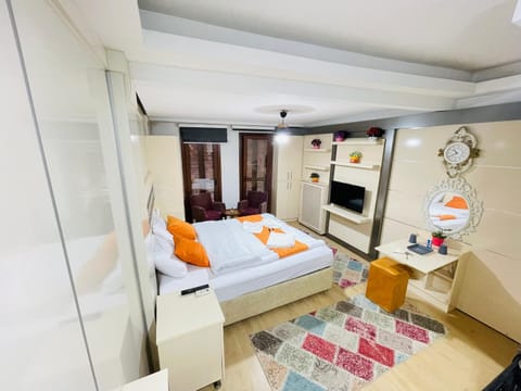 Communal lounge/ TV room, Bed, Seating area