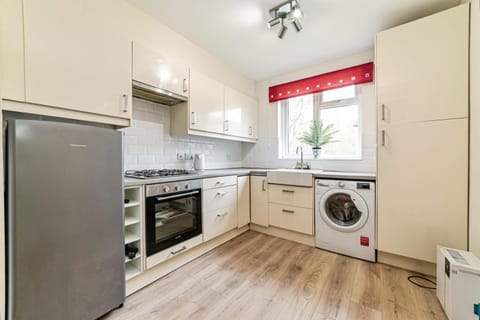 Kitchen or kitchenette, dishwasher, oven, washing machine, dryer