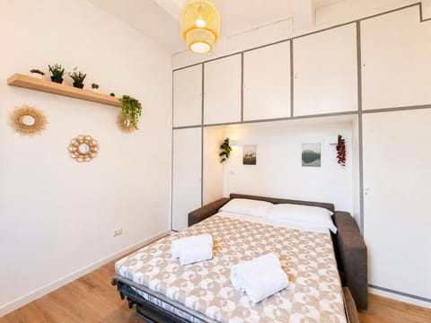 Bed, towels, wardrobe
