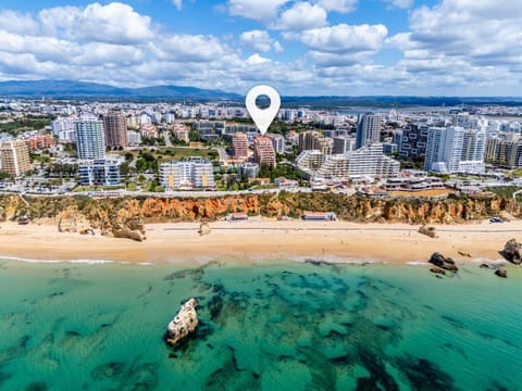 Property building, Day, Natural landscape, Beach, City view, Sea view, Location