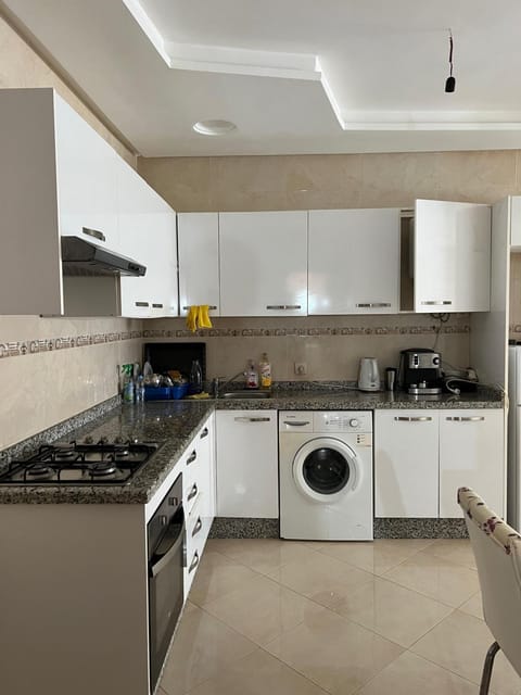 Kitchen or kitchenette, oven, stove, toaster, washing machine