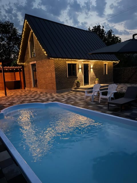 Property building, Patio, Night, Pool view, Swimming pool, sunbed