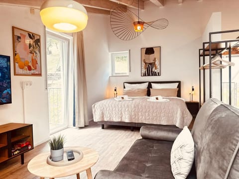 Bed, Living room, Seating area, Bedroom