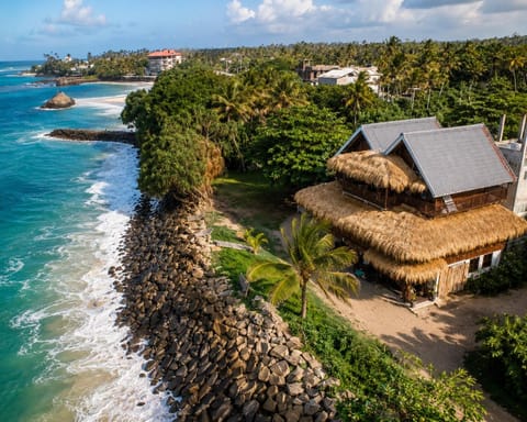 Property building, Nearby landmark, Day, Natural landscape, Beach, Sea view