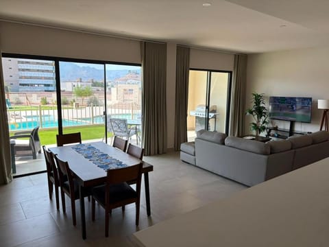 TV and multimedia, Living room, Photo of the whole room, Seating area, Dining area, Evening entertainment, Pool view, Swimming pool
