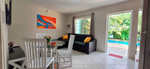 Restaurant/places to eat, TV and multimedia, View (from property/room), Living room, Seating area, Garden view, Pool view, Swimming pool
