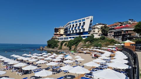 Property building, Nearby landmark, Day, Natural landscape, Beach