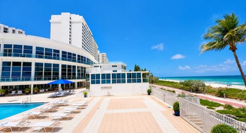 Property building, Nearby landmark, Day, Natural landscape, Beach, Pool view, Sea view, Swimming pool, sunbed
