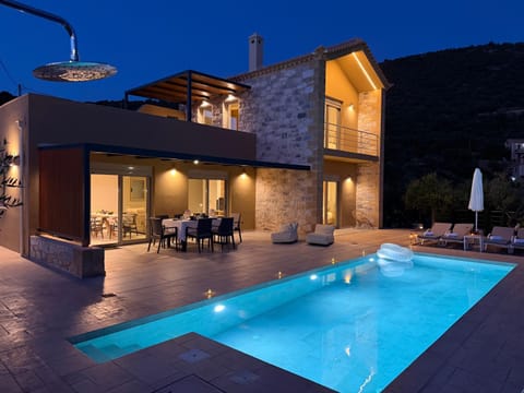 Property building, Patio, Night, Natural landscape, Balcony/Terrace, Balcony/Terrace, Pool view, Swimming pool, furniture, furniture, sunbed
