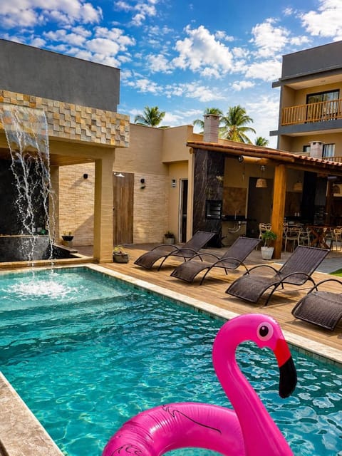 Property building, Patio, Day, Natural landscape, Pool view, Swimming pool, sunbed