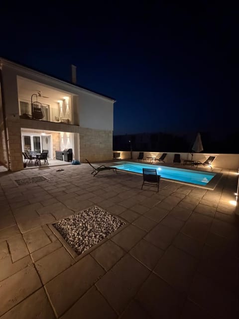 Patio, Night, Pool view, Swimming pool, sunbed