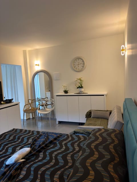 Bed, Living room, Seating area, Bedroom