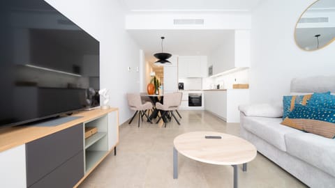 TV and multimedia, Kitchen or kitchenette, Living room, Photo of the whole room, Seating area, Dining area, air conditioner