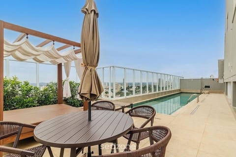 Balcony/Terrace, Seating area, City view, Swimming pool