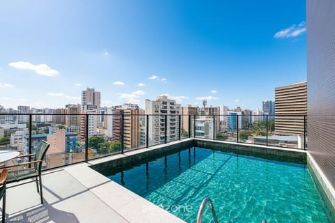 Balcony/Terrace, Seating area, City view, Swimming pool