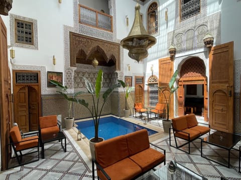 Patio, Living room, Seating area, Pool view, Swimming pool