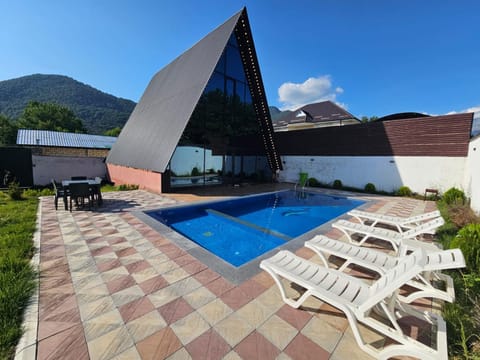 Property building, Day, Natural landscape, Mountain view, Pool view, Swimming pool, sunbed