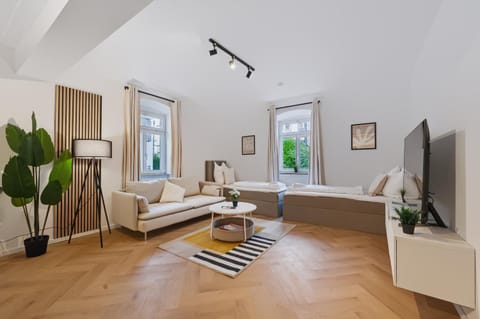 Bed, TV and multimedia, Living room, Seating area, Bedroom, air conditioner